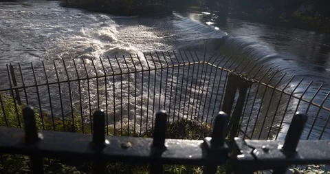 River weir with strong current and metal railings in foreground Stock Footage 121151758