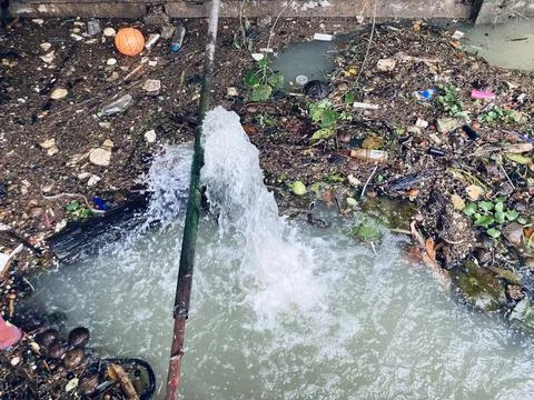 The river which is full of garbage that people dump into it Stock Photos