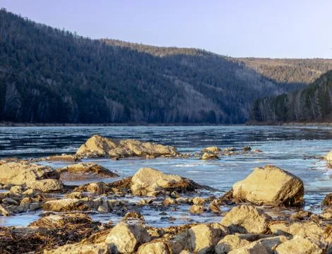 The river on which the Shuga floats in front of the icebreaker in the foregro Stock Photos