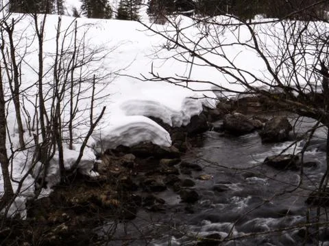 A river in a white winter landscape Stock Photos