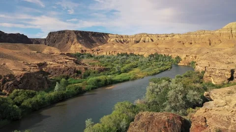 River winding through desert canyon landscape Stock Footage 314582507