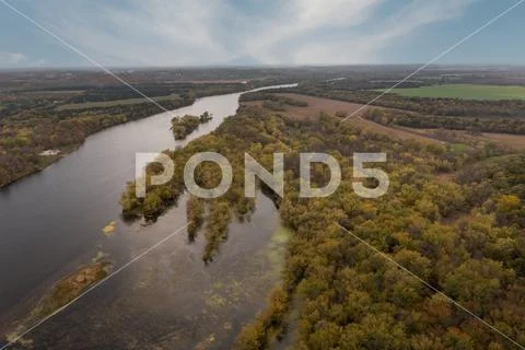 River Winds Through Forest and Farmland Autumn Stock Photo #167669295