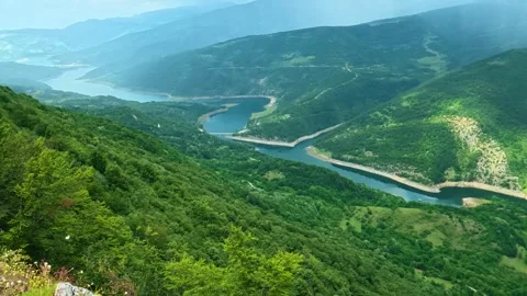 River winds through lush green mountains. Kozji Kamen viewpoint, Serbia Stockbeeldmateriaal 341875594