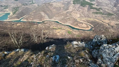 River winds through rugged, rocky hills. Balkan, Eastern Europe, POV Video stock 331814199