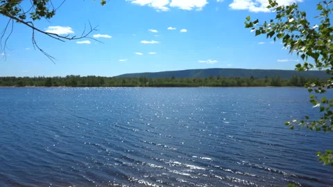 The river in windy weather. View of the river and hills Vídeos de archivo 110763441