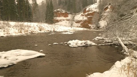 River in winter and sandstone cliff Stock Footage 103548350