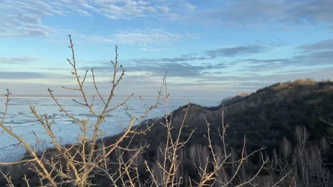 River in winter, panorama from the mountain. Solid ice on the reservoir Stock Footage 236773577