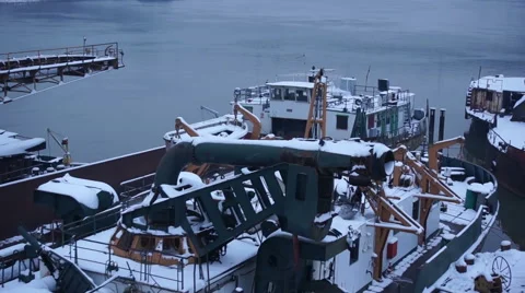 River in winter with snow and old ships aerial shot Stock Footage 48017598
