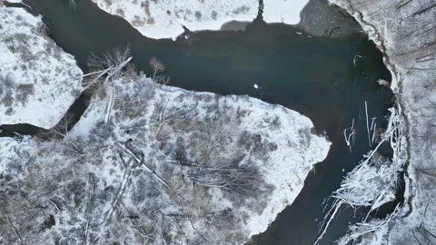 River winter snow delta floodplain meander drone aerial inland video shot in Stock Footage 226649294