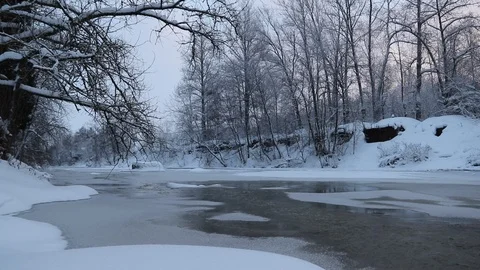 River in winter with snow. The river at dawn. Evaporation from water. Stock Footage 110048935