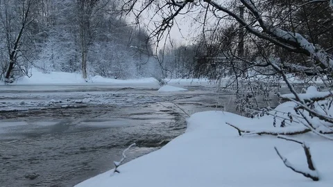 River in winter with snow. The river at dawn. Evaporation from water. Stock Footage 110051406