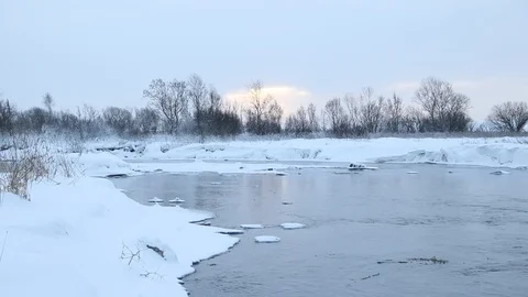 River in winter with snow. The river at dawn. Evaporation from water. Stock Footage 110055661