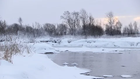 River in winter with snow. The river at dawn. Evaporation from water. Stock Footage 110058731
