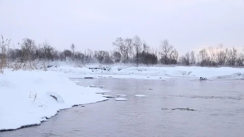 River in winter with snow. The river at dawn. Evaporation from water. Stock Footage 110062265