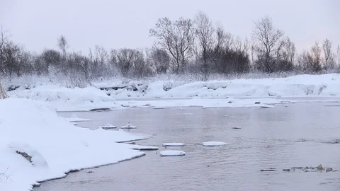 River in winter with snow. The river at dawn. Evaporation from water. Stock Footage 110063004