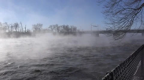 A river in the winter time with mist rising over rushing water. Stock Footage 60644203