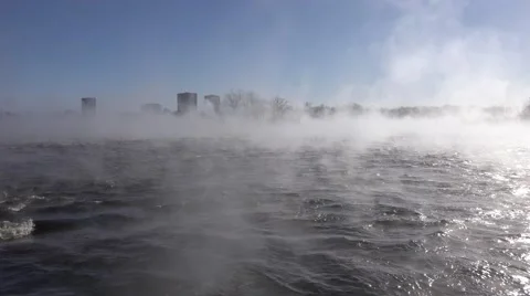 A river in the winter time with mist rising over rushing water. Stock Footage 60644498