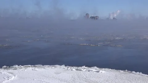 A river in the winter time with mist rising over rushing water. Stock Footage 60644559