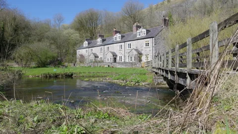 The River Wye flowing past the Chee Dale railway cottages Stock Footage 308757505