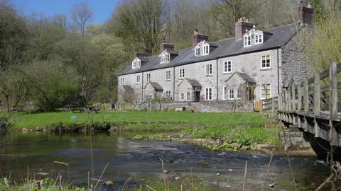 The River Wye flowing past the Chee Dale railway cottages Stock Footage 308757736