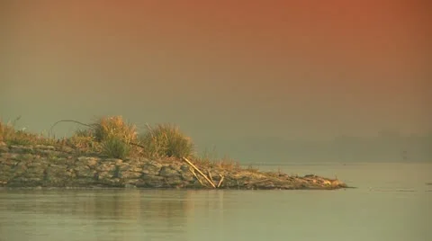 Riverbank, red sun Stock Footage 21759402