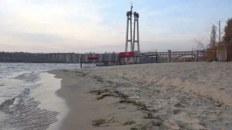 Riverbank winter landscape empty beach bridges Stock Footage 147586448