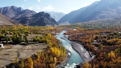 Riverbanks glowing with fall color in the remote mountains of Kargil. Stock Footage 310782080