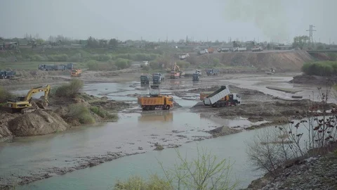 Riverbed destroyed by trucks and excavators Stock Footage 127080480