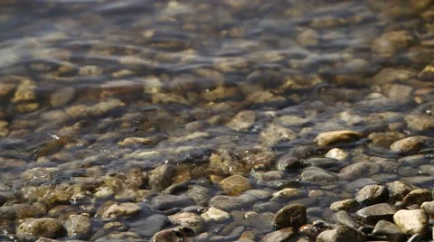 Riverbed with small waves and stones Stock Footage 48482621