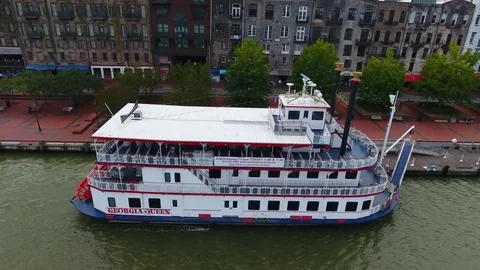 Riverboat located at River Street Savannah Georgia aerial pan out shot Stock Footage