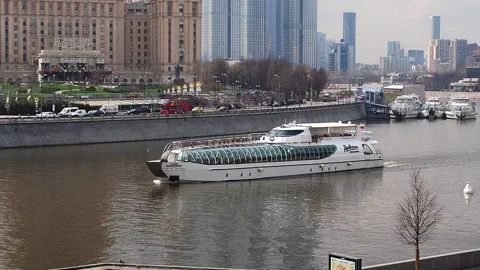A riverboat is sailing down the river. The beginning of river navigation. Stock Footage 186717870