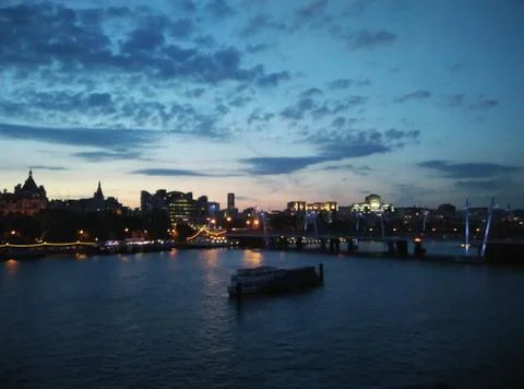 Riverfront skyline during evening Stock Photos