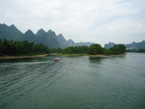 Riverscape with mountains Stock Photos