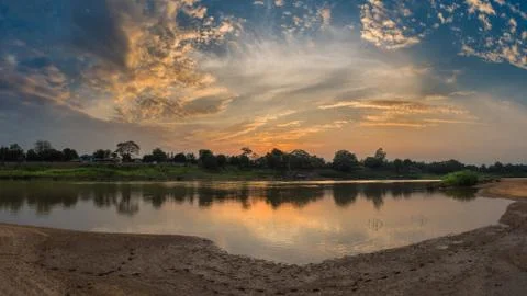 Riverside and sunset sky. Composition of nature. Stock Photos