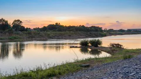 Riverside and sunset sky. Composition of nature. Stock Photos