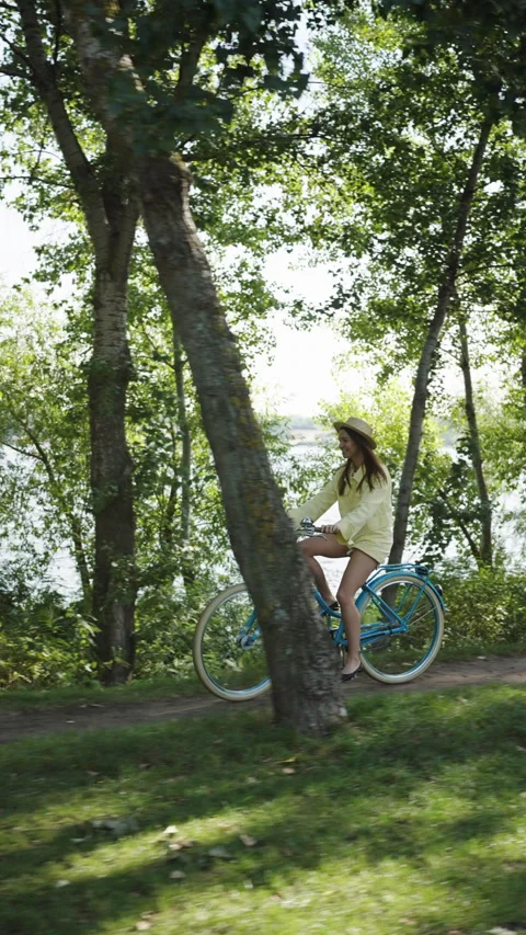 Riverside Bicycle Ride in Lush Setting Stock Footage 268196494