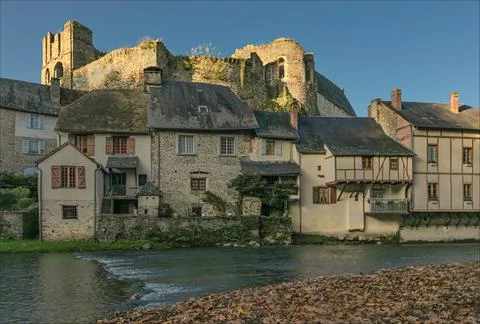 The riverside buildings based under the ancient chateau with autumn fallen .. Stock Photos