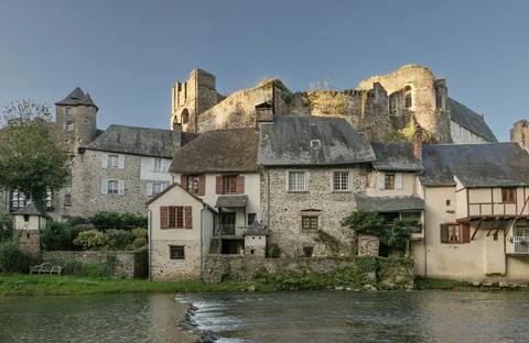 The riverside buildings based under the ancient chateau Stock Photos