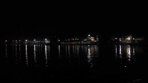 Riverside at night with lights Video stock 126769572