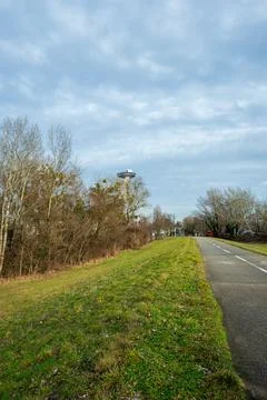 Riverside path to SNP Bridge tower in Bratislava on overcast day Stock Photos