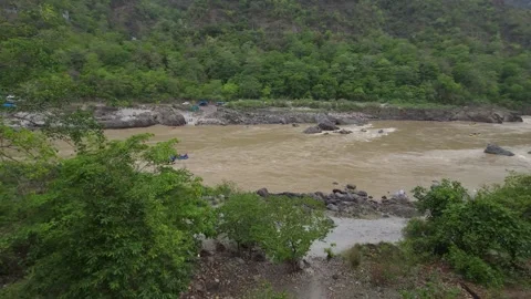 Riverside Reflections: Boating Views in Rishikesh Stock Footage 313564121