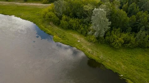 Riverside Scene with Forest and Path in Nowy Lubiel, Poland Stock Photos