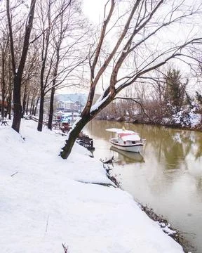 Riverside in the snow in winter Stock Photos