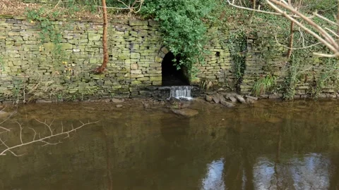 Riverside stone culvert Stock Footage 167008371