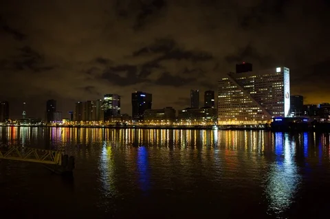 Riverside view of city at night timelapse Stock Footage 72588663