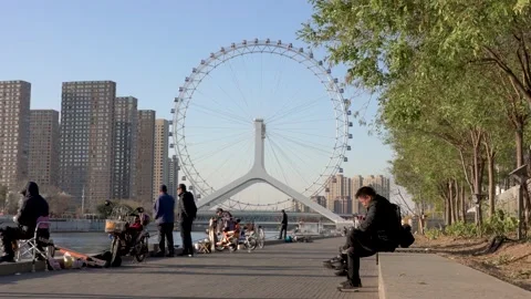 Riverside view of the Tianjin Eye Stock Footage 130836322