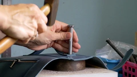 Rivet install in leather workshop Stock-Footage 118135486