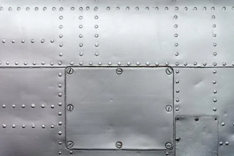 Riveted metal aircraft panel texture with industrial background Stock Photos