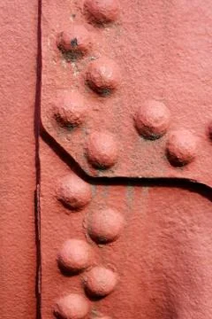 Riveted metal wall surface Stock Photos