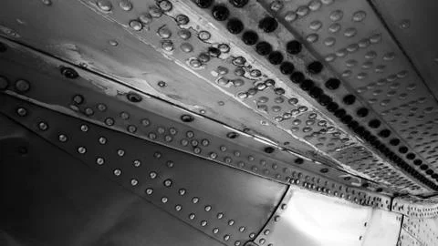 RIVETS ON THE BELLY OF A BOMBER. Stock Photos